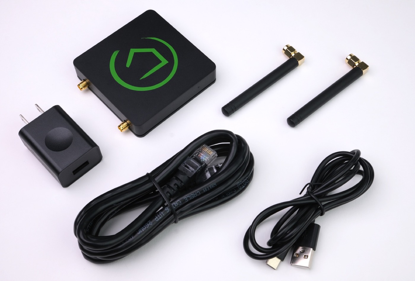 Hubitat Elevation hub, power supply, Ethernet cable, USB cable, and two antennas