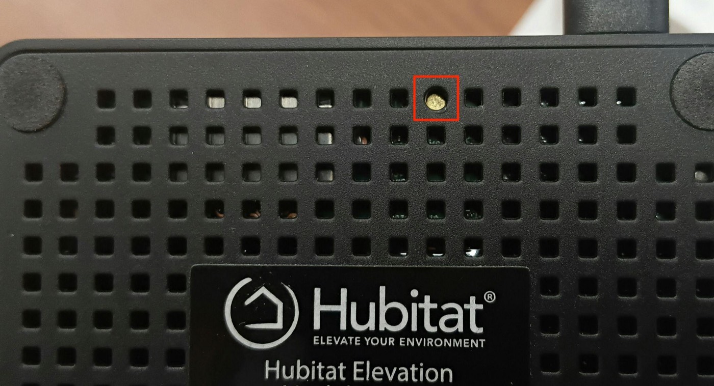 Underside of the Hubitat Elevation hub with the reset button highlighted